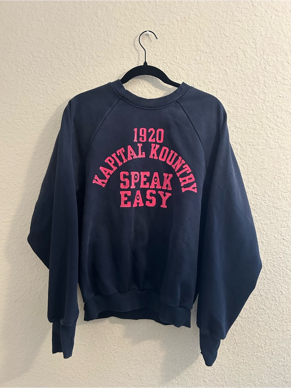Kapital Navy Crewneck Sweatshirt with Pink 'Speak Easy' Graphic